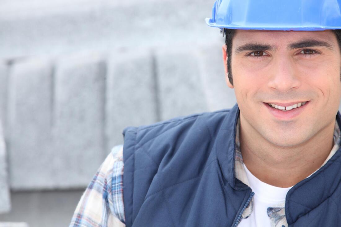 man in construction site wearing working clothes